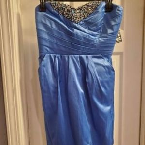 Women's sz 7, light blue satin, strapless dress. Padded bust, rhinestone detail.